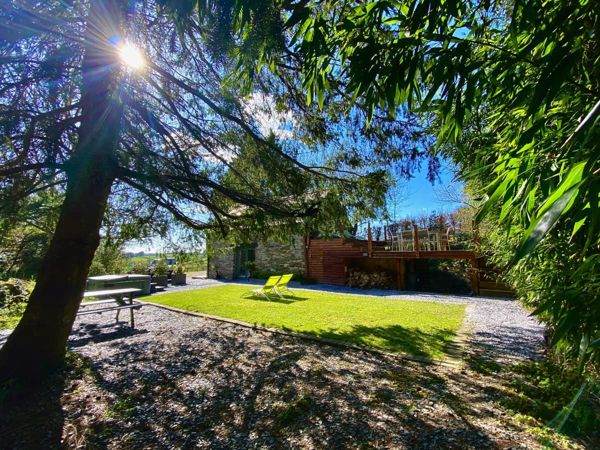 Sunridge Lodge, a beautiful country retreat set in a lush garden, on a sunny day
