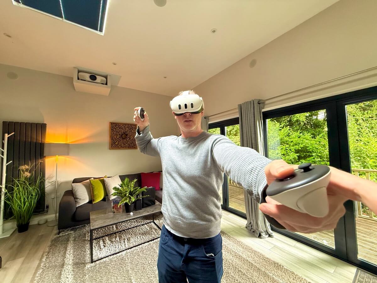 Guest pointing VR controllers in cubes. 