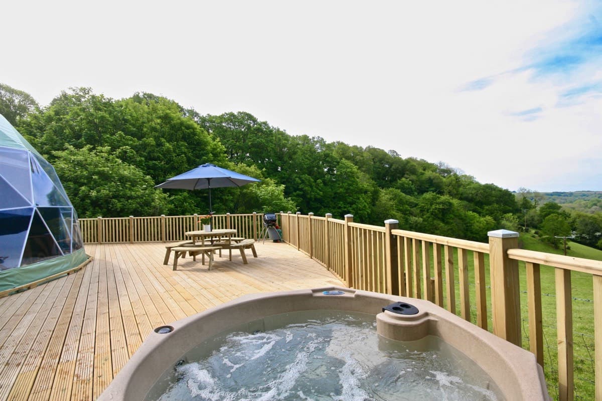 Private spa experience: Enjoying a luxurious soak in the hot tub at the Sunridge Geodome