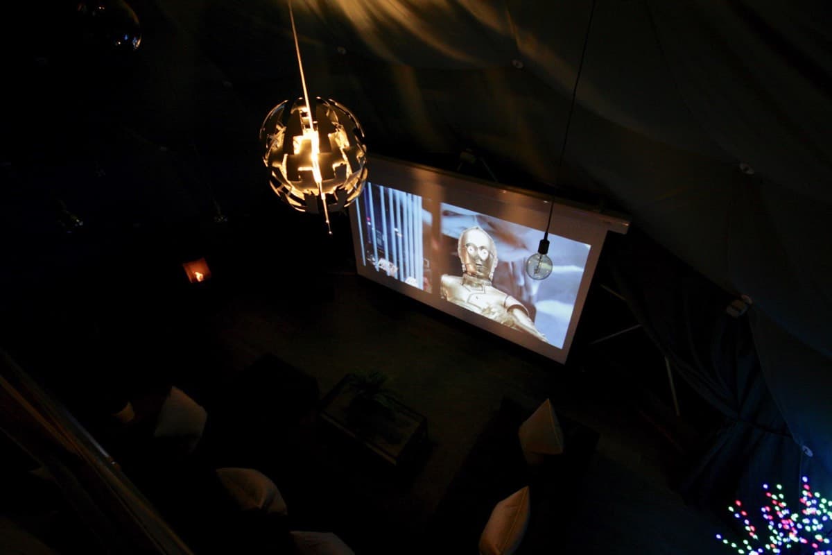 Ultimate entertainment: Cinema screen and projector setup in the Sunridge Geodome - Sunridge Retreats