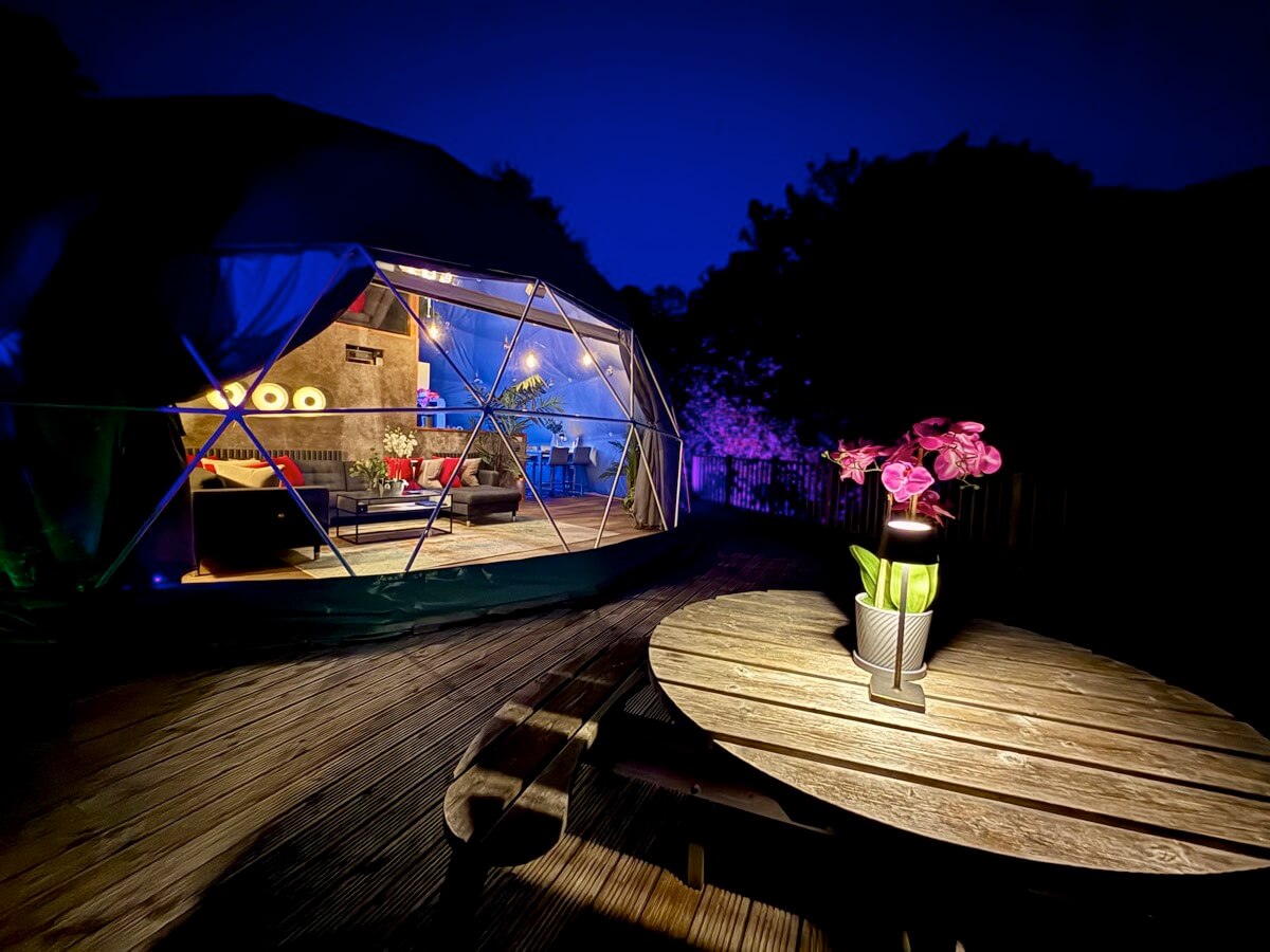 Sunridge Geodome exterior at night with mood lighting.